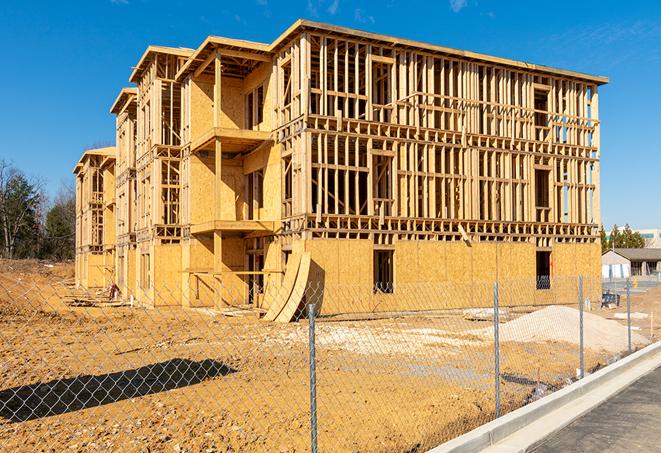 construction zone secured with a temporary fence, marked with warning signs in Port Orange